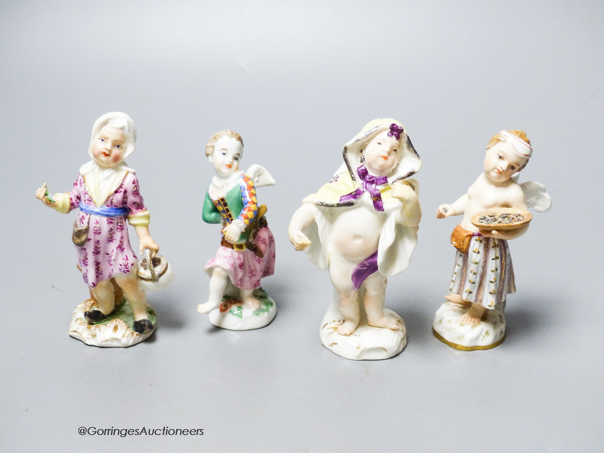 Two mid 18th century Meissen figures of Cupid in disguise and two similar 19th century figures, tallest 9cm